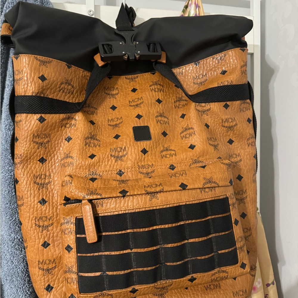 MCM Tan and Black Backpack with Iconic Logo and Quilted Design